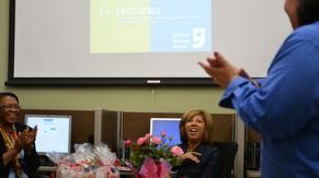 Volunteer Paola Stone congratulates graduates of Intel &copy; Easy Steps computer skills course. The training was offered through a collaboration with Fresh Start Women&rsquo;s Foundation and Goodwill Career Center in Chandler.